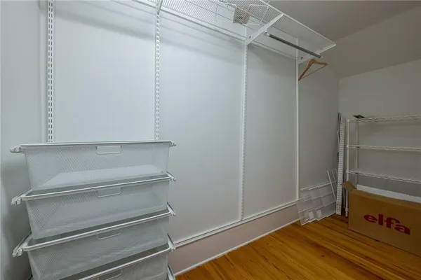 a bathroom with a tub a window and a shower