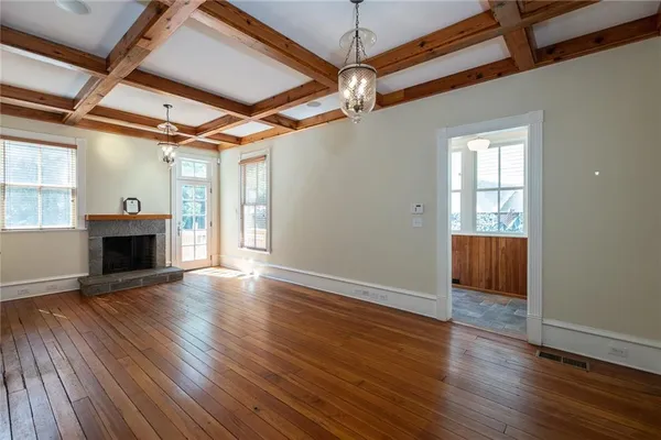 a view of balcony with wooden floor and fence