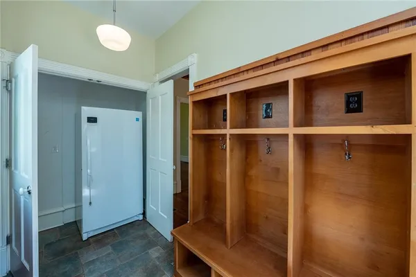 a front view of a house with a yard and porch