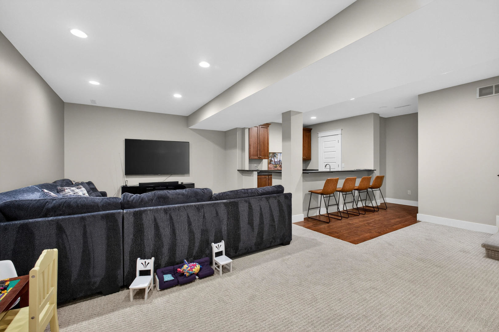 5700 Emily Road Bettendorf, IA 52722 - Photo 43 of 58 a view of a livingroom with furniture and a flat screen tv