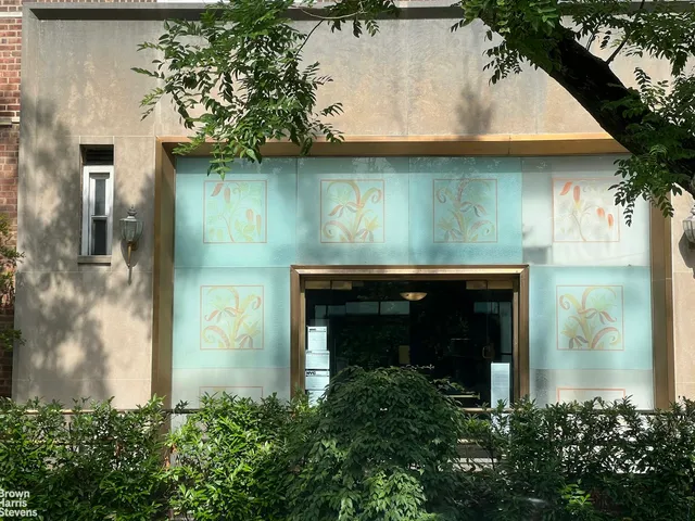 a living room with a couch coffee table and a piano table with wooden floor