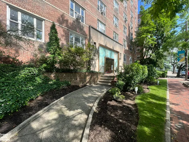 an outdoor view of house with green space
