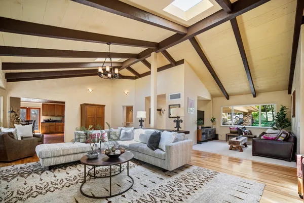 a living room with furniture or couch and a table