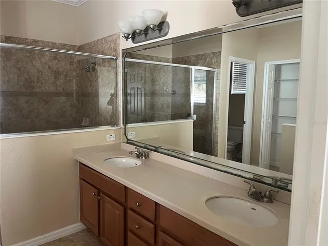 a bathroom with a sink and mirror