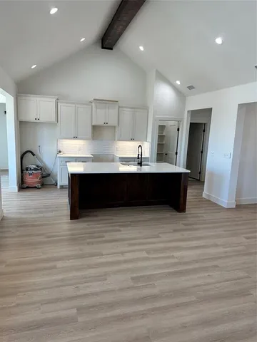 a view of kitchen with stainless steel appliances granite countertop a sink and a dishwasher