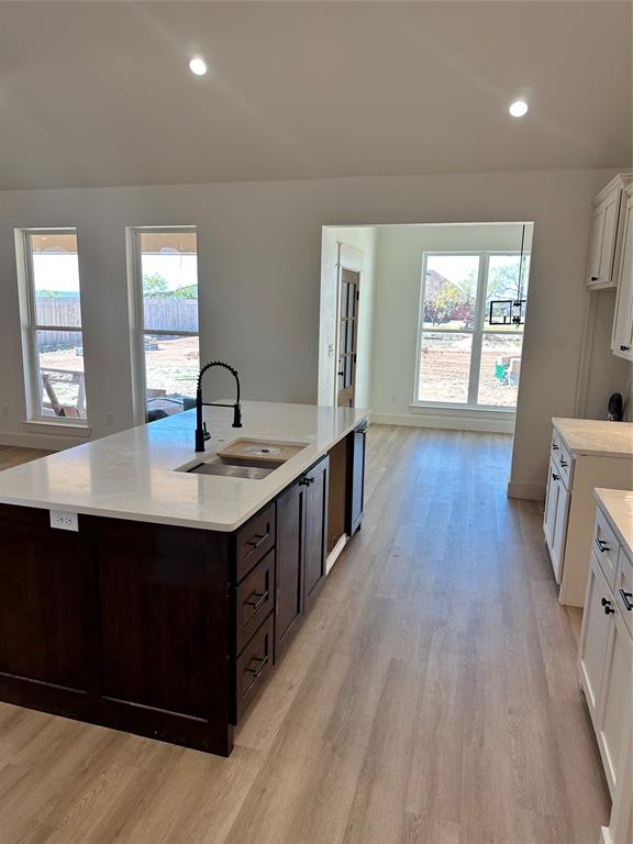 150 Ridge Road Tuscola, TX 79562 - Photo 7 of 12 a kitchen with a sink and wooden floor