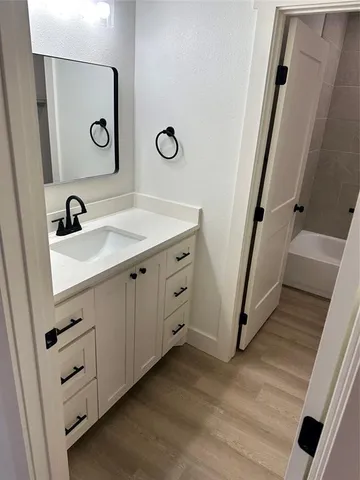 a bathroom with a sink and a mirror