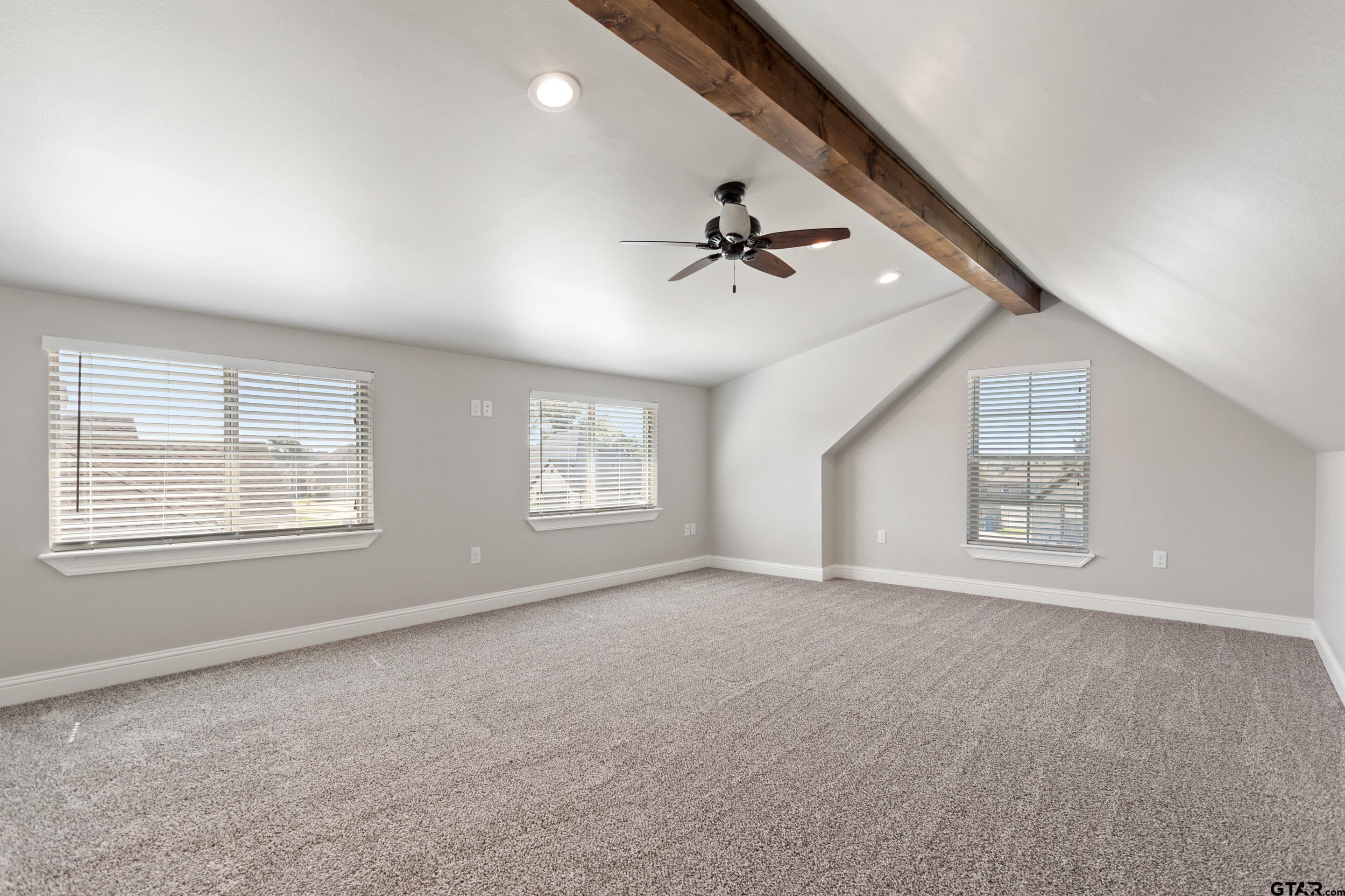 105 Nathan Road Chandler, TX 75758 - Photo 28 of 36 an empty room with windows and ceiling fan