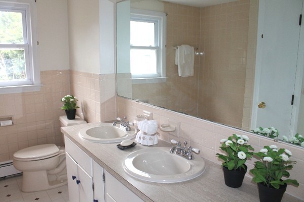 16 Freemont Street Lexington, MA 02421 - Photo 15 of 25 a bathroom with a toilet a sink and a mirror