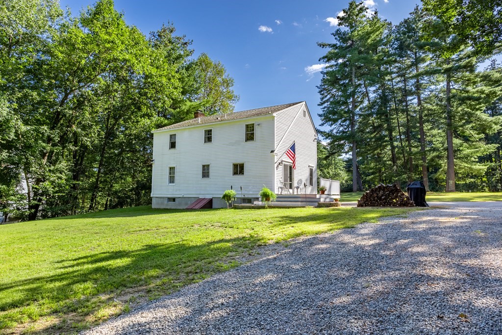 10 Pheasant Ridge Road Townsend, MA 01469 - Photo 11 of 40 a view of a house with a yard and large trees