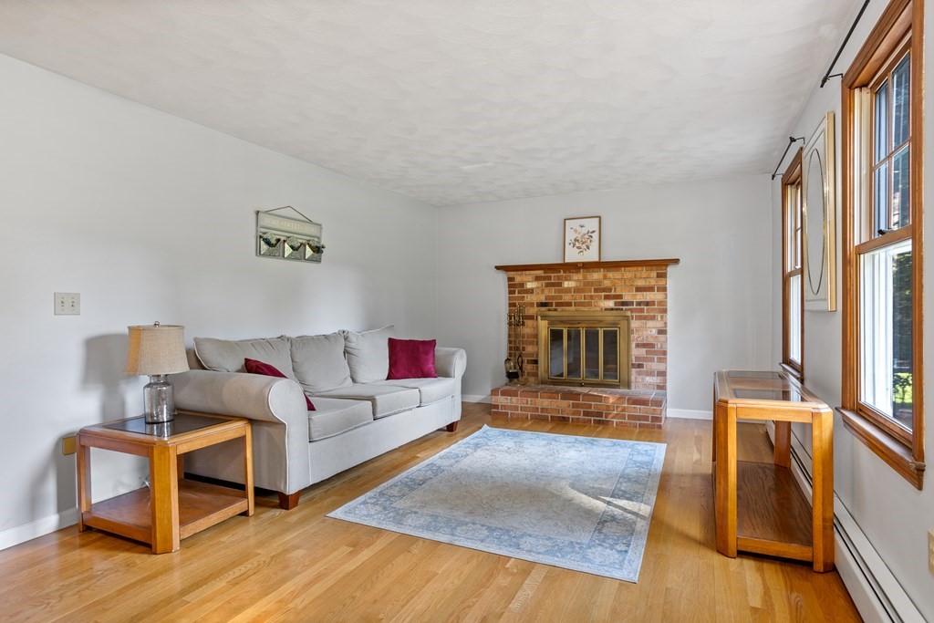 10 Pheasant Ridge Road Townsend, MA 01469 - Photo 13 of 40 a living room with furniture and a fireplace