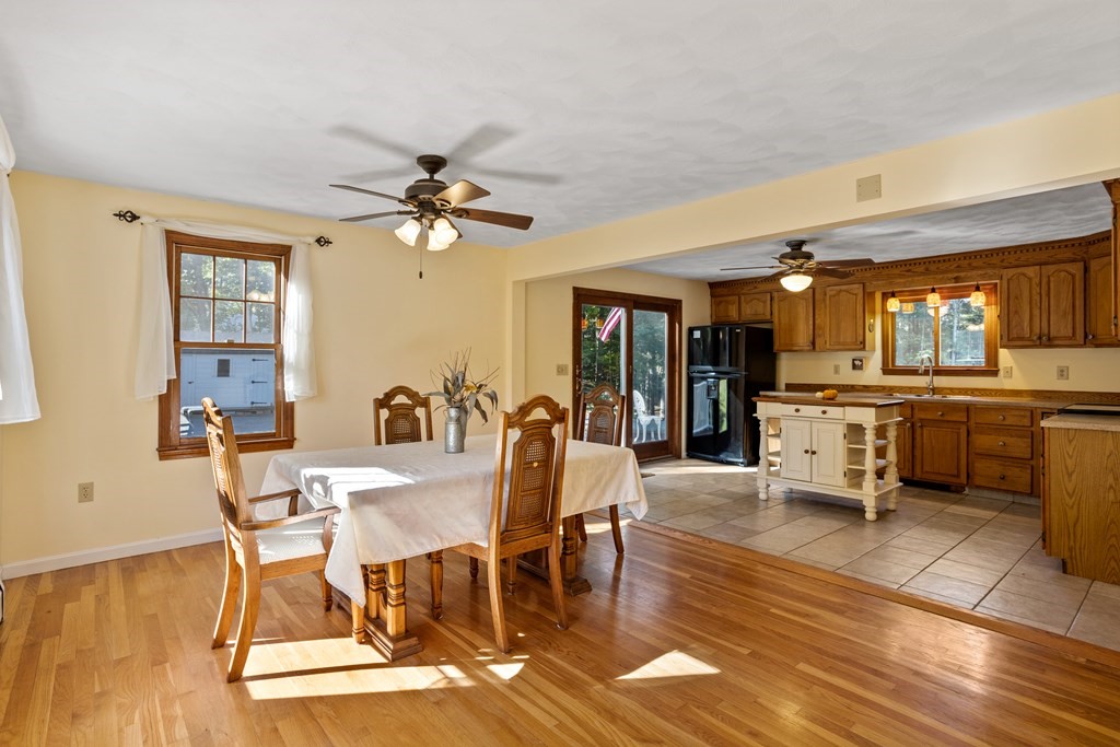 10 Pheasant Ridge Road Townsend, MA 01469 - Photo 17 of 40 a view of a dining room with furniture and a chandelier