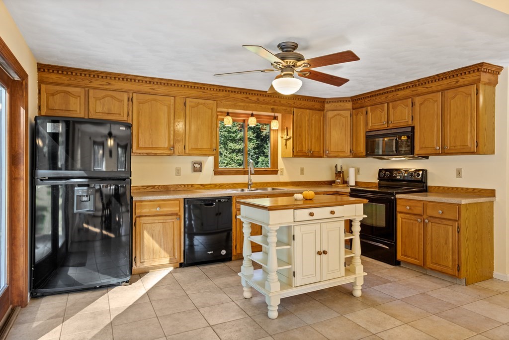 10 Pheasant Ridge Road Townsend, MA 01469 - Photo 20 of 40 a kitchen with stainless steel appliances granite countertop a stove refrigerator sink and dishwasher