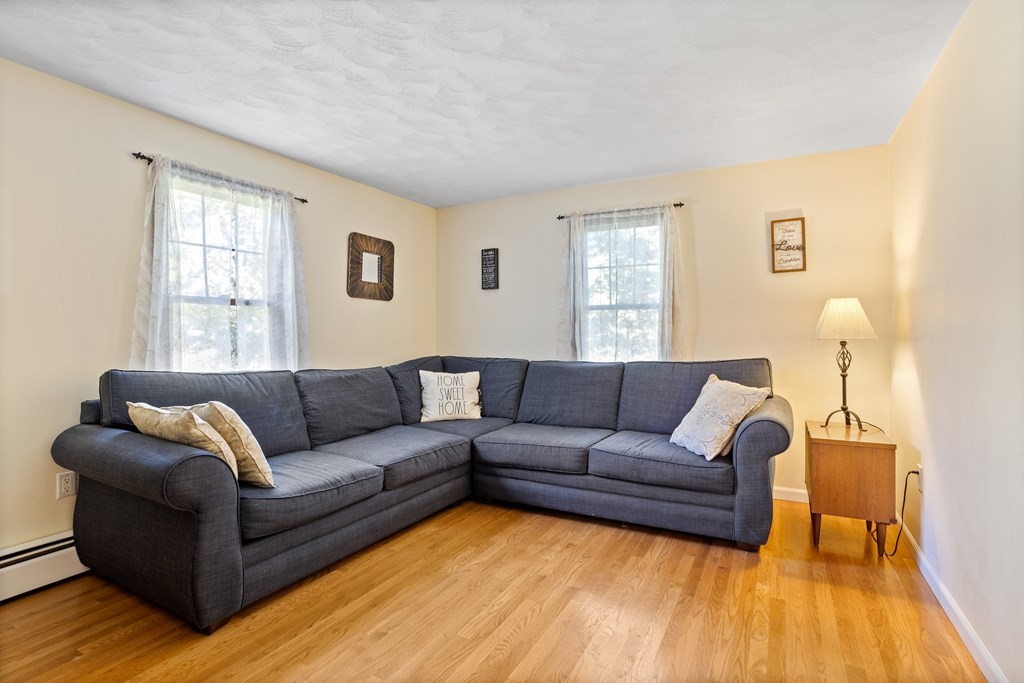 10 Pheasant Ridge Road Townsend, MA 01469 - Photo 25 of 40 a living room with furniture and a wooden floor