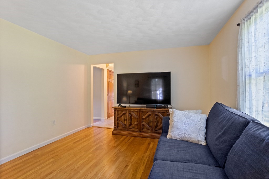 10 Pheasant Ridge Road Townsend, MA 01469 - Photo 26 of 40 a living room with furniture and a flat screen tv