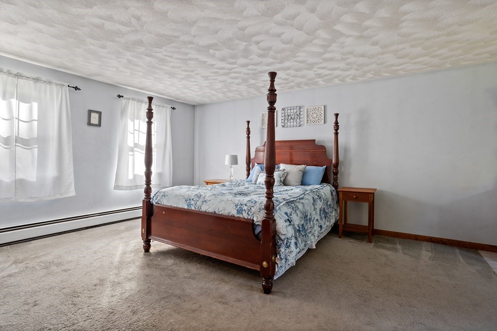 10 Pheasant Ridge Road Townsend, MA 01469 - Photo 30 of 40 a bed room with a bed and a window