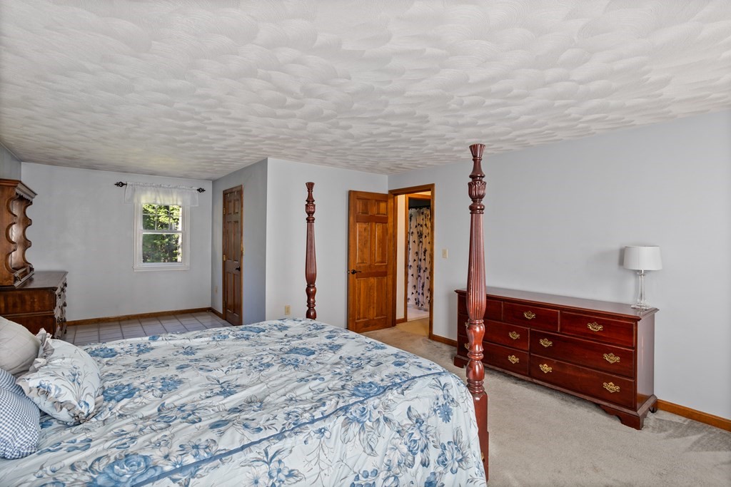 10 Pheasant Ridge Road Townsend, MA 01469 - Photo 32 of 40 a bedroom with a bed and a dresser
