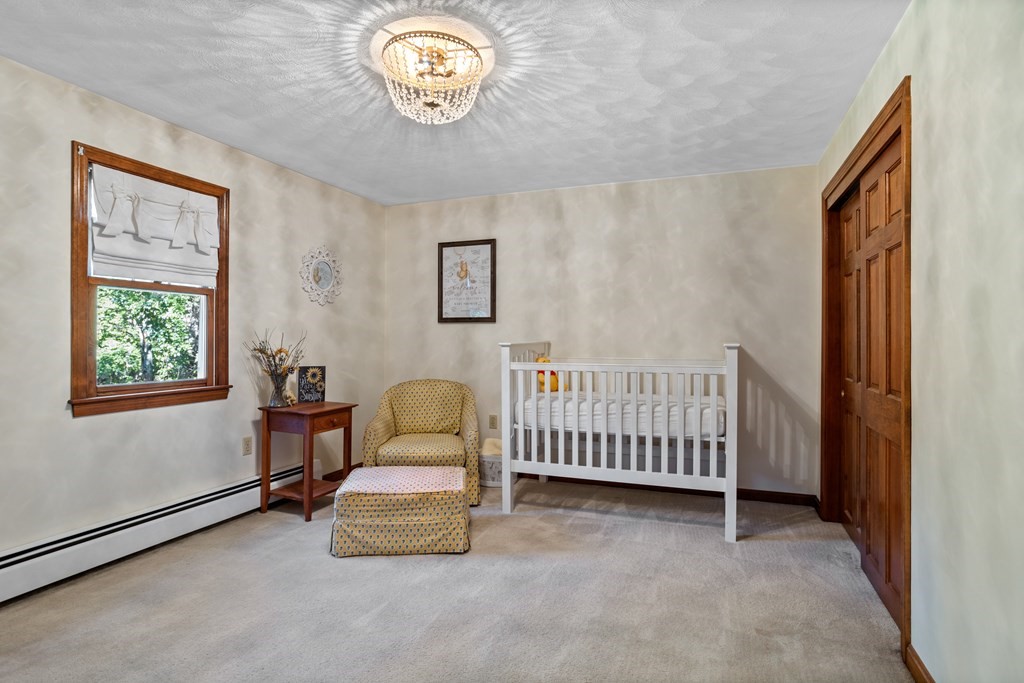 10 Pheasant Ridge Road Townsend, MA 01469 - Photo 35 of 40 a bedroom with a bed and a window