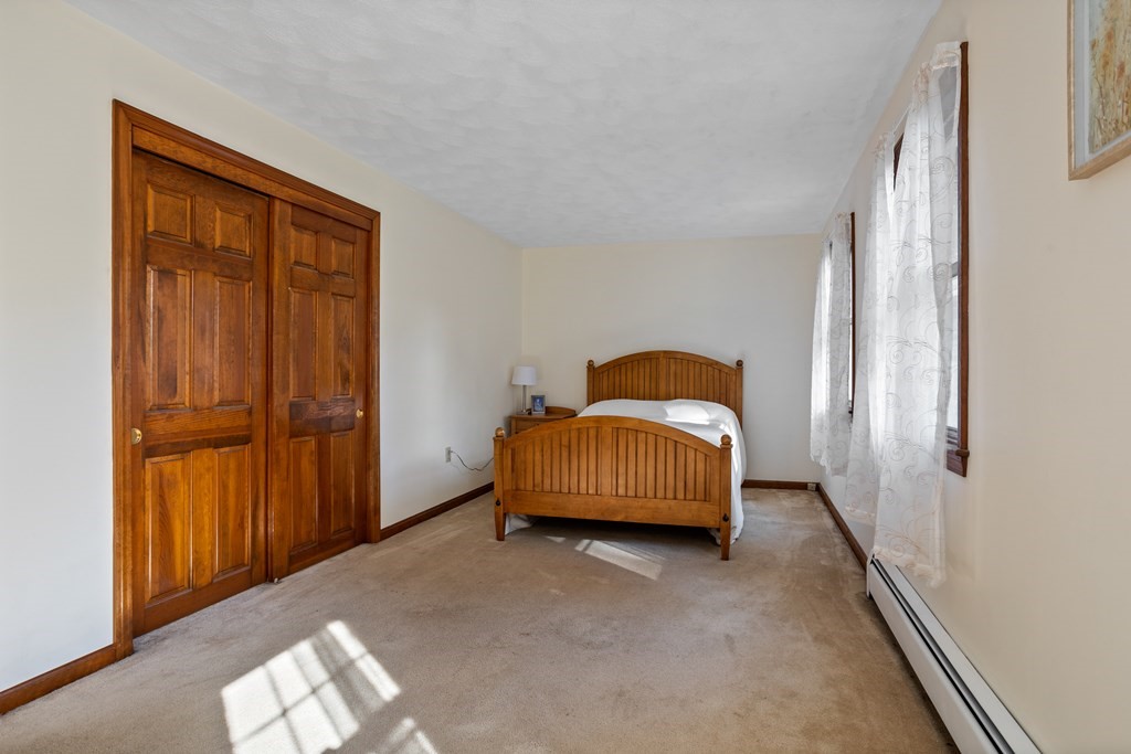 10 Pheasant Ridge Road Townsend, MA 01469 - Photo 37 of 40 a bedroom with a bed and a window