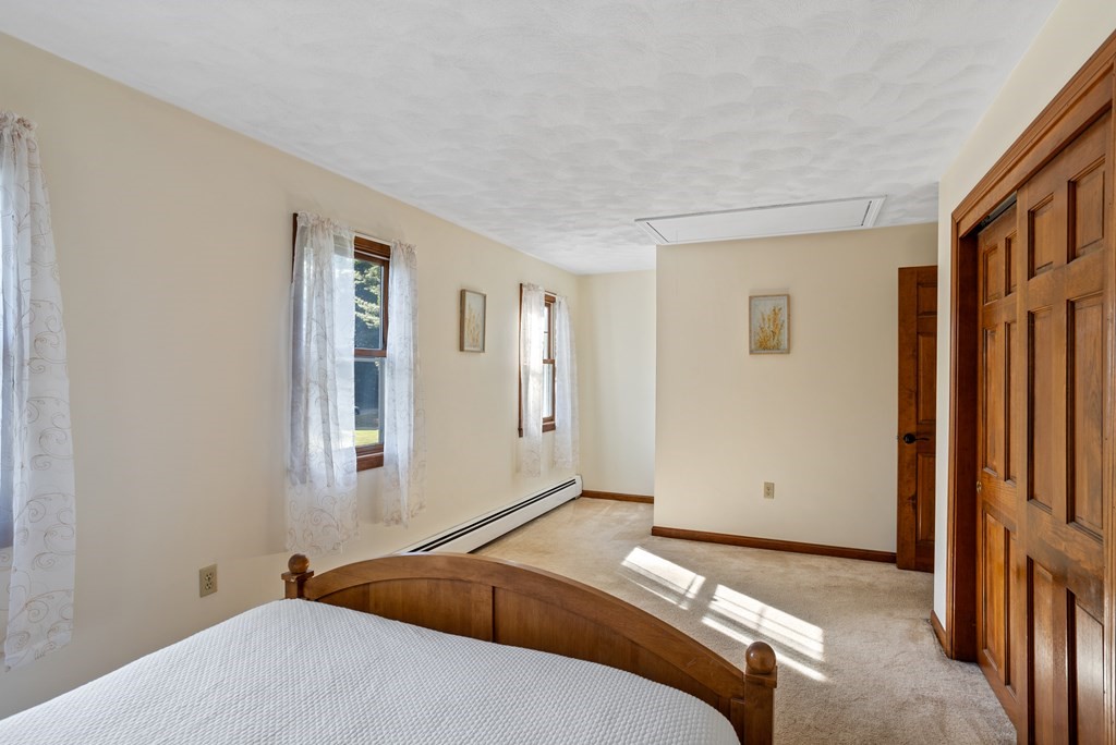10 Pheasant Ridge Road Townsend, MA 01469 - Photo 38 of 40 a bedroom with a bed and a window