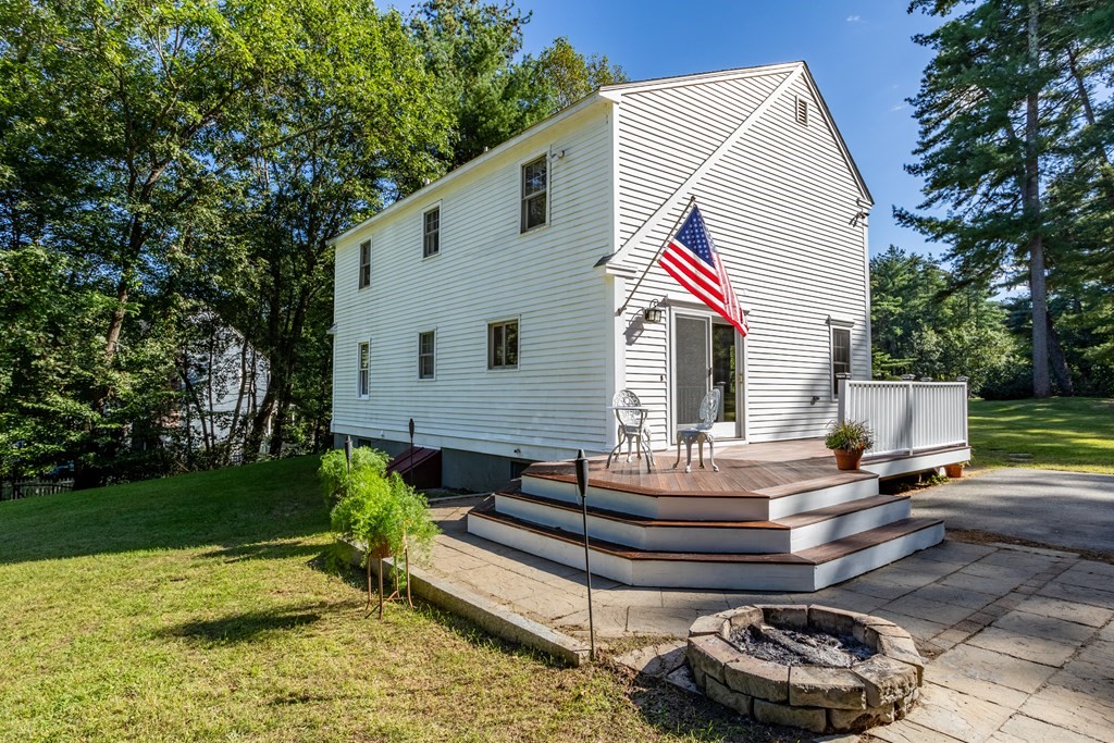 10 Pheasant Ridge Road Townsend, MA 01469 - Photo 9 of 40 a front view of a house with a garden and patio