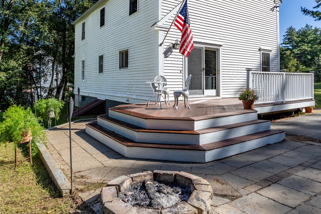 10 Pheasant Ridge Road Townsend, MA 01469 - Photo 10 of 40 a view of a chairs and tables in the back yard of the house