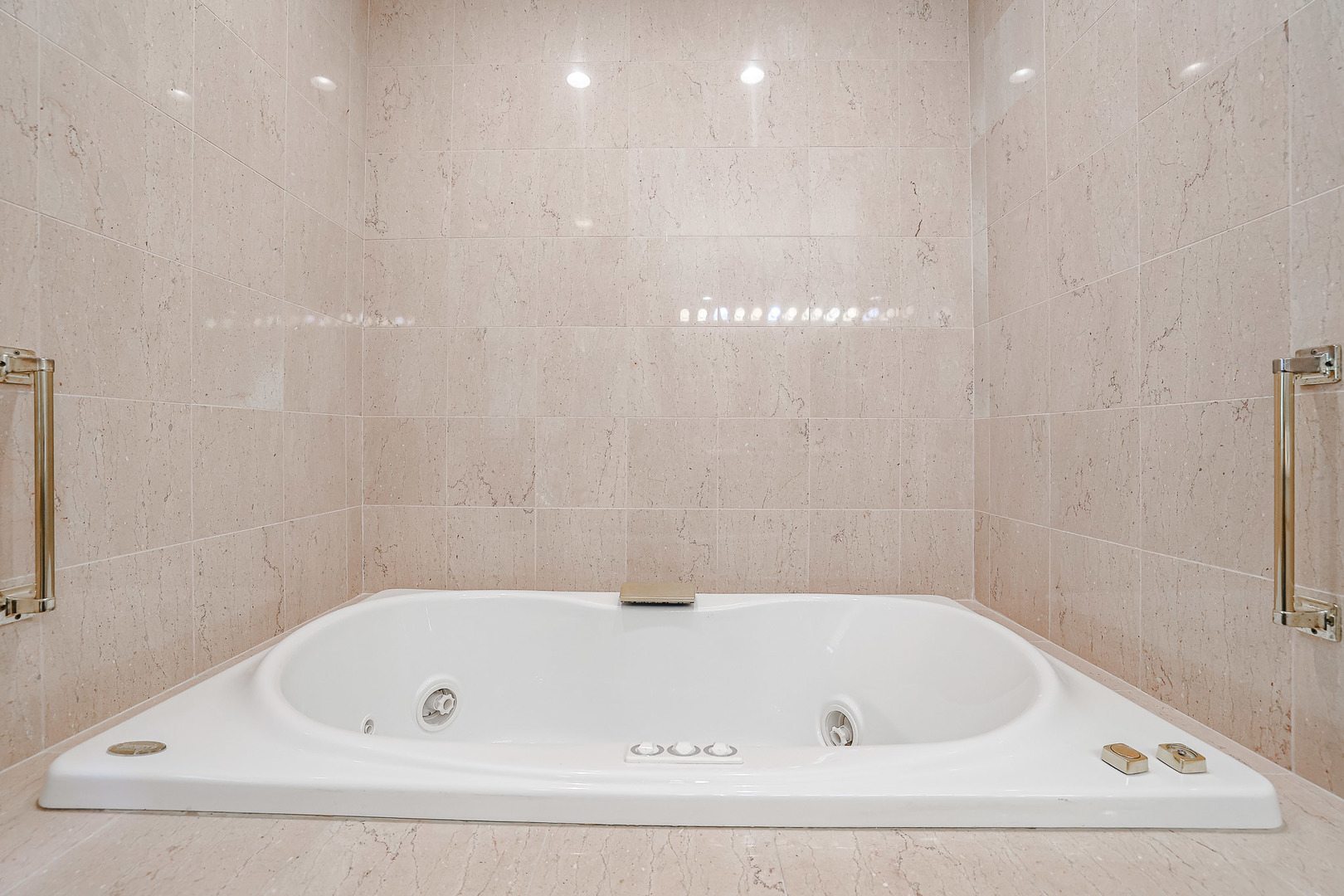 16 Ridge Road Highland Park, IL 60035 - Photo 19 of 41 a white bath tub sitting in a bathroom