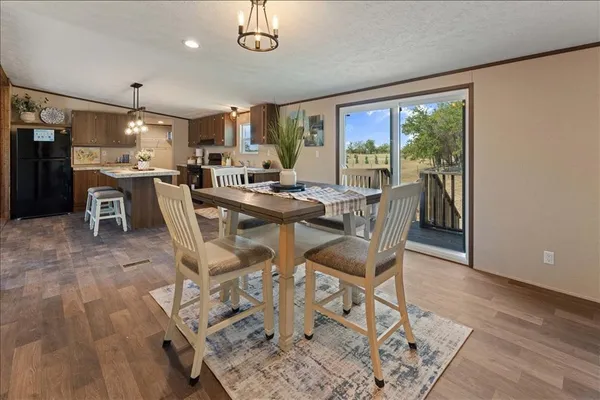 a view of a dining room with furniture window and outside view