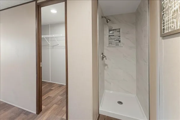 a view of a bathroom from a corridor