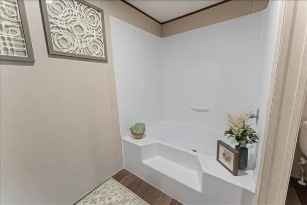a bathroom with a shower and a toilet