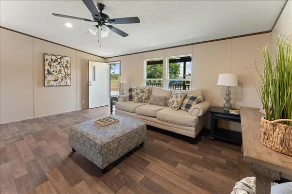a living room with furniture and a rug