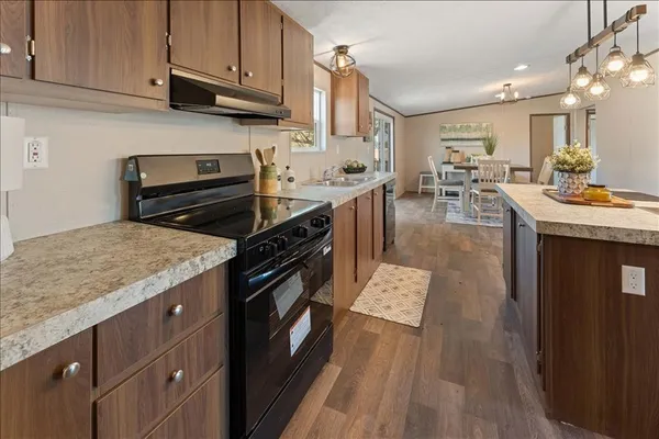 a kitchen with stainless steel appliances granite countertop a stove and a sink