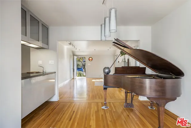 a kitchen with stainless steel appliances a stove a refrigerator and cabinets