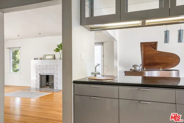 a view of living room with furniture and fireplace