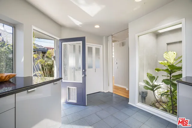 a view of entryway with window and front door