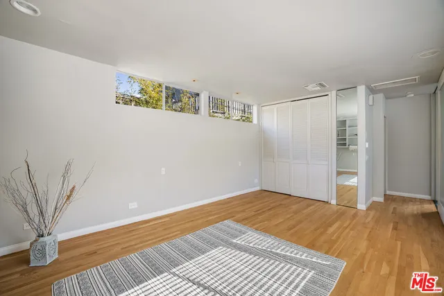 a view of a room with a wooden floor