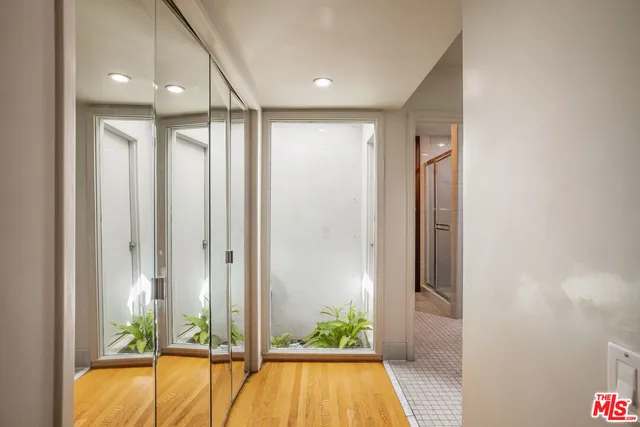 a view of a bathroom with a tub and shower