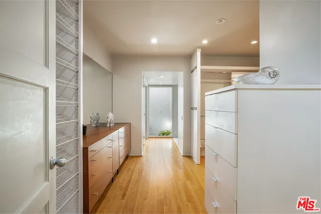 a spacious bathroom with a shower and a sink