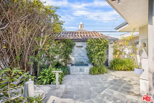 a street sign that is on a brick wall