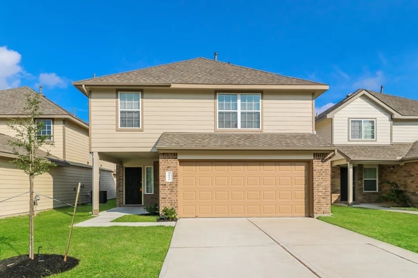 5031 Banyan Tree Trail Spring, TX 77373 - Photo 1 of 20 a front view of a house with a yard and trees