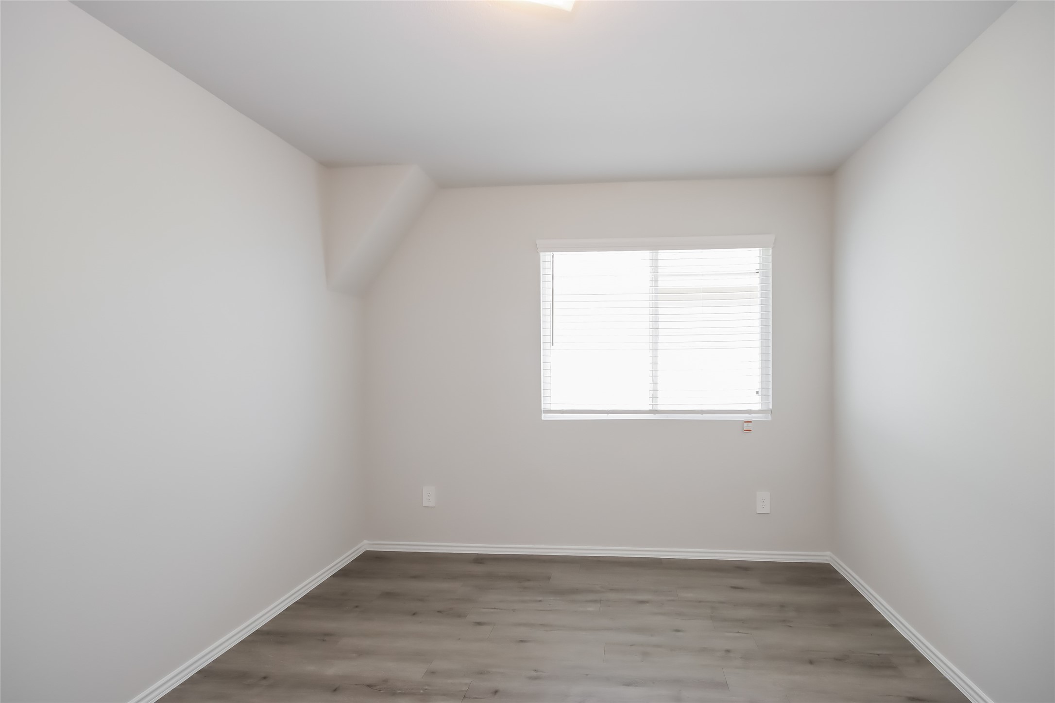 5031 Banyan Tree Trail Spring, TX 77373 - Photo 15 of 20 an empty room with wooden floor and windows