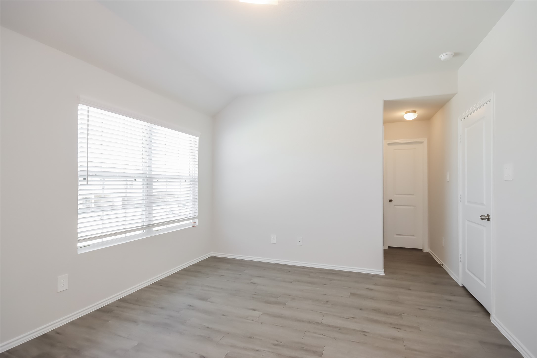 5031 Banyan Tree Trail Spring, TX 77373 - Photo 9 of 20 a view of an empty room with wooden floor and a window