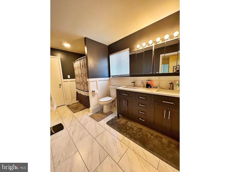402 Pheasant Circle Bear, DE 19701 - Photo 11 of 17 a bathroom with a sink and a mirror