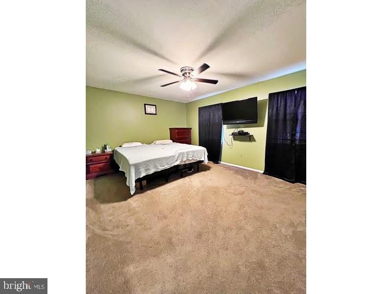 402 Pheasant Circle Bear, DE 19701 - Photo 14 of 17 a bedroom with a bed and a chandelier