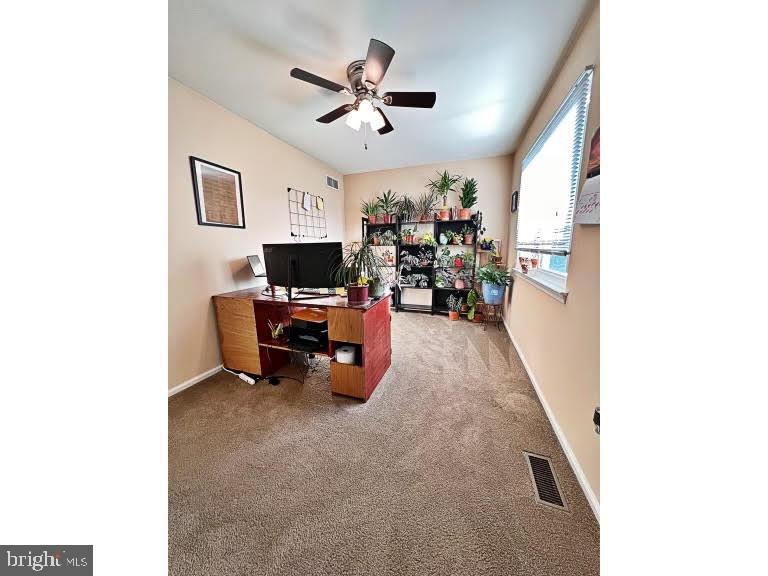 402 Pheasant Circle Bear, DE 19701 - Photo 16 of 17 a living room with furniture and a flat screen tv