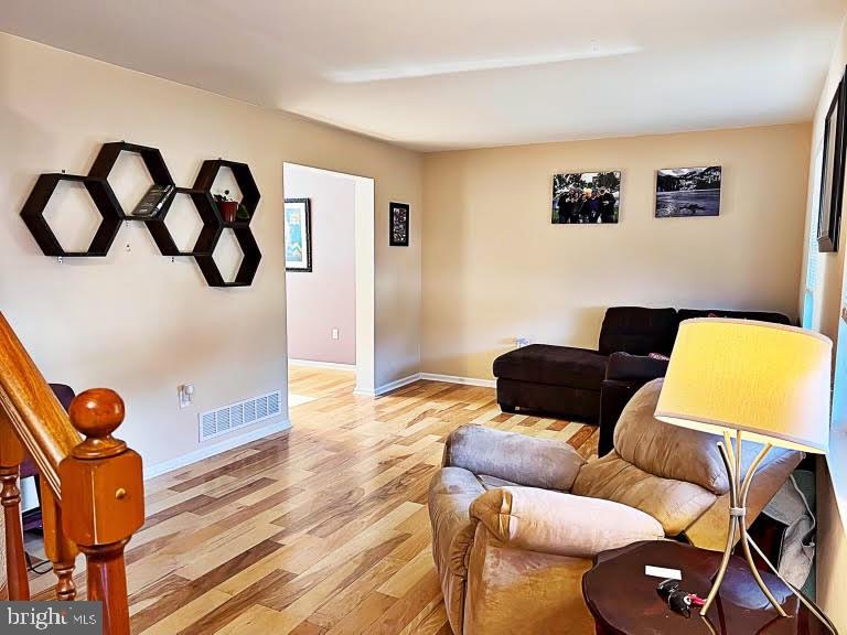 402 Pheasant Circle Bear, DE 19701 - Photo 4 of 17 a living room with furniture and wooden floor