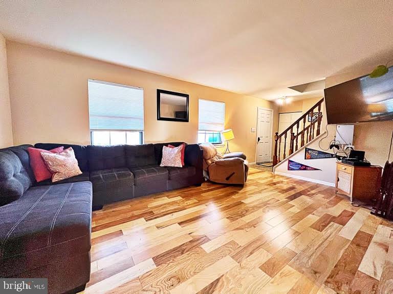 402 Pheasant Circle Bear, DE 19701 - Photo 5 of 17 a living room with a couch and a flat screen tv