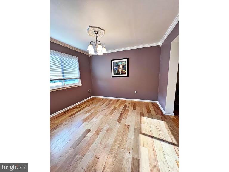 402 Pheasant Circle Bear, DE 19701 - Photo 7 of 17 a view of empty room with wooden floor