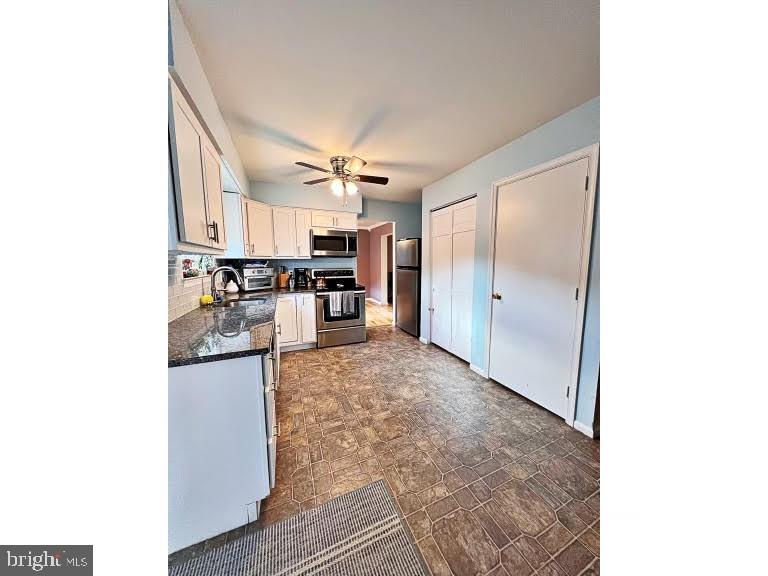 402 Pheasant Circle Bear, DE 19701 - Photo 8 of 17 a view of a kitchen with wooden floor