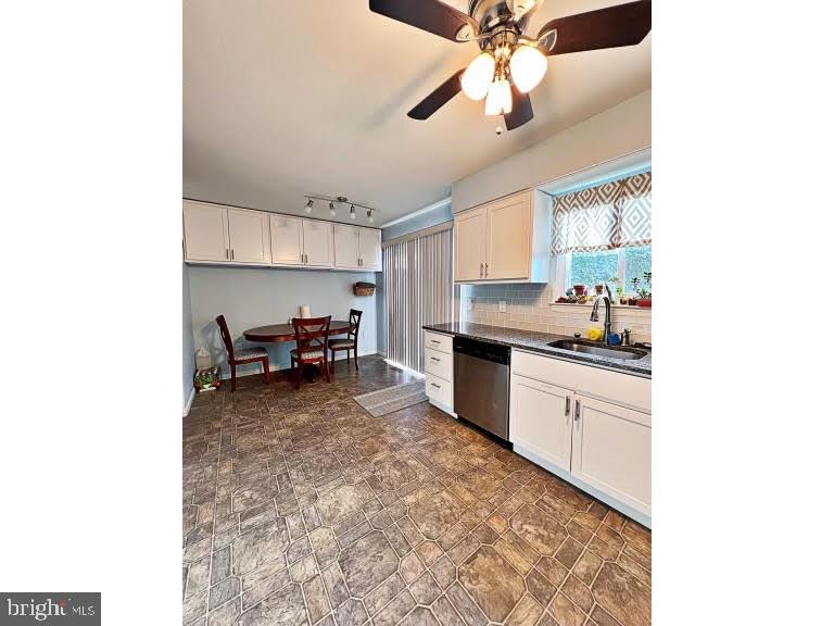 402 Pheasant Circle Bear, DE 19701 - Photo 10 of 17 a kitchen with a sink and cabinets